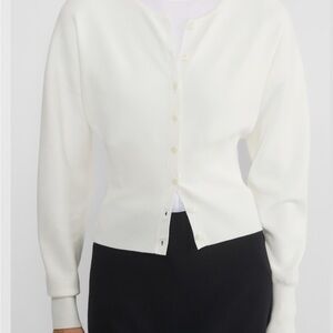 White cardigan with long sleeves and V-neck design